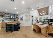 Thumbnail 18 of 20 - Modern clubhouse with dining area and workspace at Knoll Crest Apartments, San Antonio, 78240
