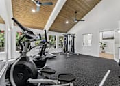 Thumbnail 15 of 20 - Fitness center with strength equipment at Knoll Crest Apartments, Texas