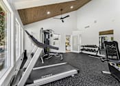 Thumbnail 13 of 20 - Fitness center with cardio equipment at Knoll Crest Apartments, Texas, 78240