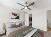 Thumbnail 42 of 47 - a bedroom with a large bed and a ceiling fan at The Hudson, North Richland Hills, 76180q