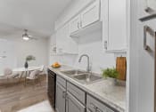 Thumbnail 3 of 50 - a kitchen and dining area at The Hills at Ironhorse, North Richland Hills, TX, 76180