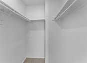 Thumbnail 8 of 50 - a spacious walk in closet in a 555 waverly unit at The Hills at Ironhorse, North Richland Hills, TX