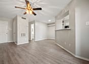 Thumbnail 25 of 38 - an empty living room with a ceiling fan at Polo Clubs Apartments, Austin, Texas