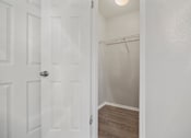 Thumbnail 13 of 38 - the closet in a small bedroom with a white door at Polo Clubs Apartments, Texas