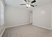 Thumbnail 30 of 38 - a bedroom with a ceiling fan and a closet at Polo Clubs Apartments, Austin