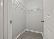 Thumbnail 32 of 38 - closet in a bedroom with white walls and wood flooring at Polo Clubs Apartments, Austin, 78729