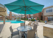 Thumbnail 6 of 21 - BBQ and seating area at Amberly Village Townhomes, Garland