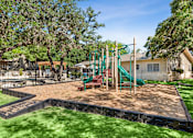Thumbnail 33 of 40 - playground with a green slide at Crosspoint Oaks at Boerne, Boerne