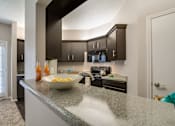 Thumbnail 17 of 23 - Kitchen Granite Countertops at Summerstone Apartments, Texas
