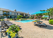 Thumbnail 10 of 23 - Poolside Relaxation Area at Summerstone Apartments, Texas, 76021