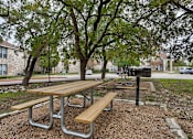 Thumbnail 8 of 24 - a picnic area with benches and a grill at The Broadwater at Salado Creek, Texas