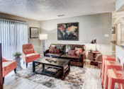 Thumbnail 44 of 50 - Living Room with lots of natural light and hardwood style floors at The Hills at Ironhorse, North Richland Hills