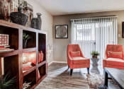 Thumbnail 48 of 50 - Large living room with lots of natural light and hardwood style floors at The Hills at Ironhorse, North Richland Hills, TX