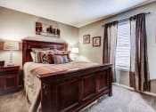 Thumbnail 49 of 50 - Master bedroom with carpet and lots of natural light at The Hills at Ironhorse, North Richland Hills, TX, 76180