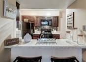 Thumbnail 46 of 47 - Stunning eat in kitchen with espresso cabinets and modern backsplash at The Hudson, Texas, 76180