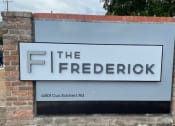 Thumbnail 54 of 54 - a sign for the frederick sign in front of a brick wall at The Frederick, San Antonio