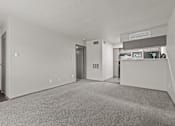 Thumbnail 37 of 43 - A carpeted room with a white wall and a door.at Rock 35, Round Rock