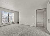 Thumbnail 36 of 43 - A room with a carpeted floor and a window with blinds.at Rock 35, Texas, 78681