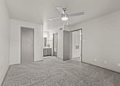 Thumbnail 40 of 43 - A spacious room with a ceiling fan and carpeted floor.at Rock 35, Round Rock, TX