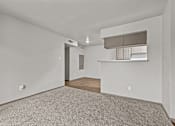 Thumbnail 23 of 43 - A room with a carpeted floor and a wooden floor in the back.at Rock 35, Round Rock, 78681