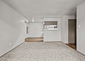 Thumbnail 28 of 43 - A spacious room with a carpeted floor and a window with blinds.at Rock 35, Round Rock, 78681