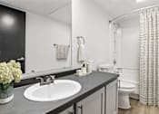 Thumbnail 24 of 45 - a bathroom with a sink and a toilet at Tradewinds, Texas, 78239