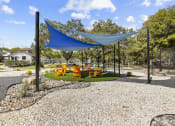 Thumbnail 18 of 60 - Shaded Lounge Area at Maxwell Townhomes, San Antonio, Texas
