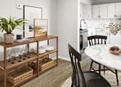 Thumbnail 22 of 79 - a dining room with a table and chairs and a kitchen in the background  at Sunset Heights, San Antonio