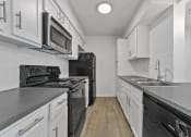Thumbnail 53 of 58 - white cabinets and black appliances at Vesper, Dallas, TX