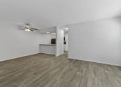 Thumbnail 52 of 58 - an empty living room with a ceiling fan at Vesper, Dallas, 75254