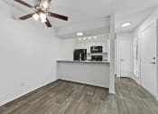 Thumbnail 50 of 58 - a kitchen and living room with a ceiling fan at Vesper, Dallas, Texas