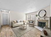 Thumbnail 27 of 58 - a living room with a fireplace and a couch  at Vesper, Dallas, TX, 75254