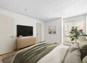 Thumbnail 34 of 58 - a bedroom with a large bed and a flat screen tv  at Vesper, Dallas, TX, 75254