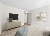 Thumbnail 37 of 58 - a bedroom with a large bed and a tv on the wall at Vesper, Dallas