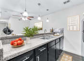 Thumbnail 45 of 58 - a kitchen with a sink and a refrigerator  at Vesper, Dallas, 75254
