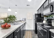 Thumbnail 44 of 58 - our apartments offer a modern kitchen  at Vesper, Dallas, TX