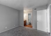 Thumbnail 49 of 54 - a bedroom with gray walls and a carpeted floor at The Frederick, Texas, 78240
