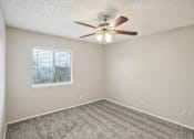 Thumbnail 58 of 63 - a bedroom with a ceiling fan and a window at The Keller, San Antonio, TX  