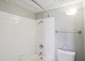 Thumbnail 61 of 63 - a white bathroom with a shower and a toilet at The Keller, San Antonio, 78230  
