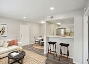 Thumbnail 3 of 63 - a living room with a couch and a bar and a kitchen at The Keller, San Antonio  