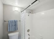 Thumbnail 13 of 63 - a white bathroom with a shower and a toilet at The Keller, Texas  
