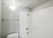 Thumbnail 47 of 63 - a white bathroom with a toilet and a shower at The Keller, Texas, 78230