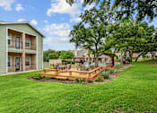 Thumbnail 9 of 42 - Southgate Glen pavilion with trees and a wooden deck at Southgate Glen, Weatherford, TX, 76086