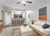 Thumbnail 41 of 55 - a living room with a white couch and a kitchen in the background