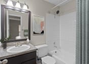 Thumbnail 48 of 55 - a bathroom with a sink and a toilet and a tub