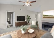 Thumbnail 50 of 55 - a living room with a ceiling fan and a fireplace