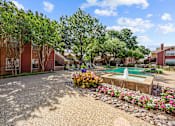 Thumbnail 6 of 32 - A residential area with a pool and a garden.