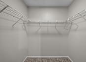 Thumbnail 32 of 32 - Empty white closet with shelves and a carpeted floor.