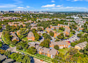 Thumbnail 28 of 28 - A bird's eye view of a residential area with houses and trees.