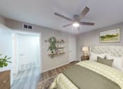 Thumbnail 39 of 54 - a bedroom with a ceiling fan and a bed with a yellow and white comforter at The Frederick, San Antonio